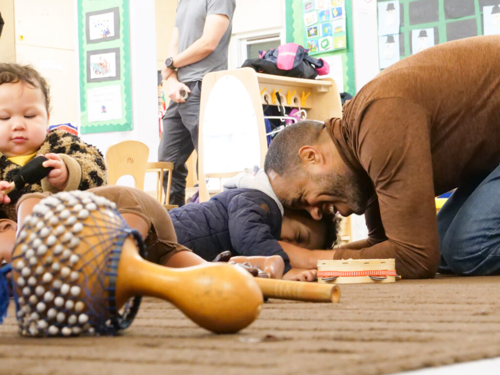 A dad enjoying playtime with his young child in Brockwell at a LEAP event.
